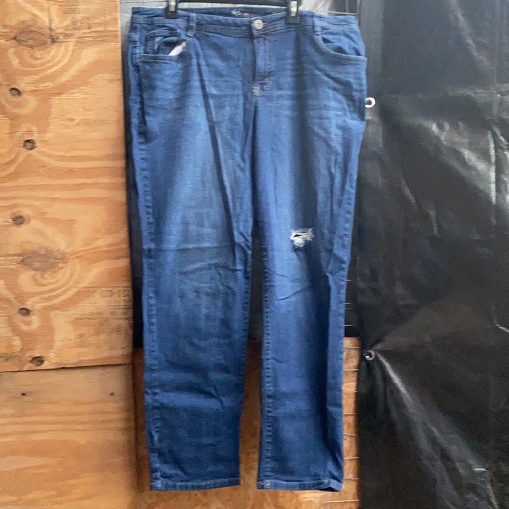 Jeans with intentional butt tear